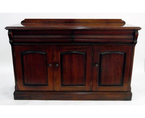 Victorian-style mahogany side cupboard with moulded edge, two frieze drawers, three arched panelled cupboards below enclosing