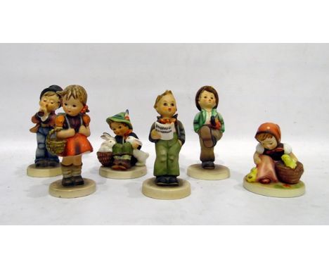 Six Goebel Hummel figures to include boy with rabbits, girl with basket, etc 