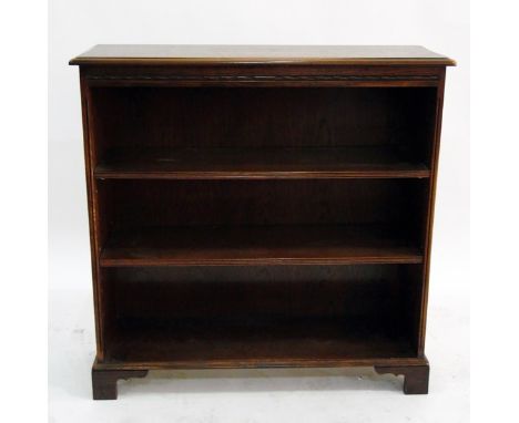 Oak open bookcase with moulded edged top, two adjustable shelves, raised on bracket feet, width 90cm 