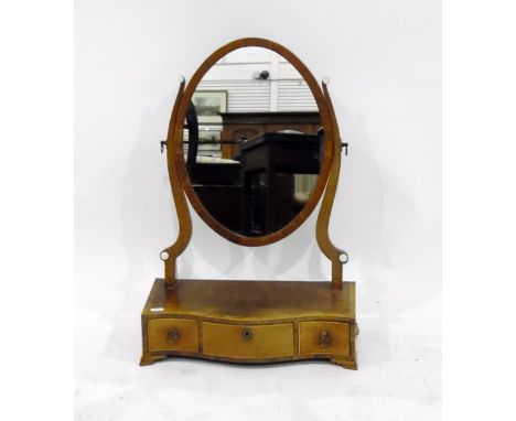 Georgian mahogany oval swing frame dressing table mirror, with serpentine box base enclosing three drawers, raised on ogee br