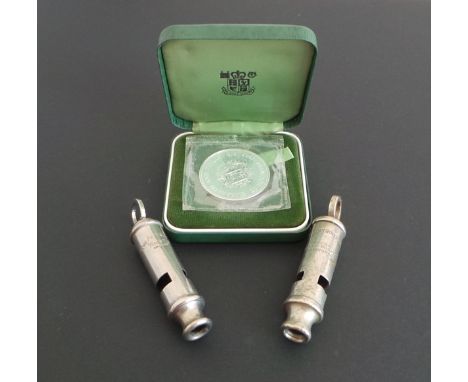 Two vintage Police whistles and a silver proof crown coin, the whistles ACME City and Metropolitan by J Hudson & Co (Birmingh