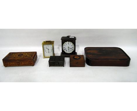 Metamec quartz 20th century mantel clock, a modern desk clock, a carved wooden jewellery box, another box, a brass casket and