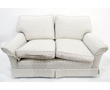 Modern beige upholstered two-seater sofa 