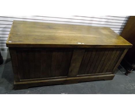 Large oak chest with hinged top above slatted panels, on raised bracket feet, length 155cm 