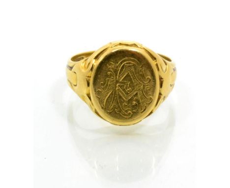 An 18 carat gold signet ring, an oval plaque with engraved monogram, to fancy tapering shoulders, finger size P 8g