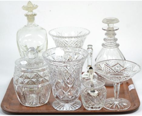 An early 19th century three ring neck decanter (associated stopper); an oversized waisted decanter engraved with a crest and 
