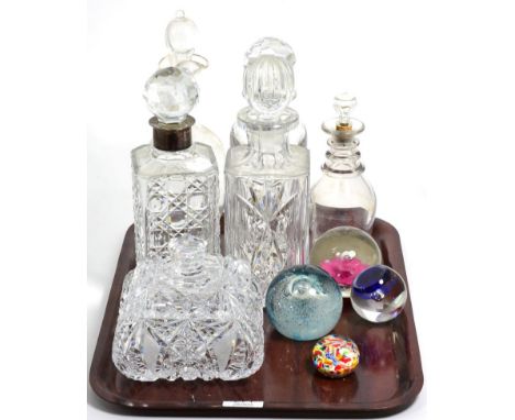 A group of decanters including a silver collared example, together with Caithness and other paperweight etc