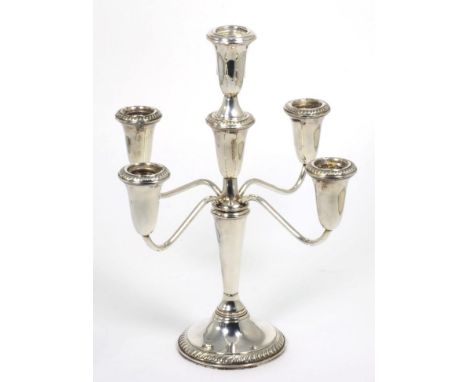An American sterling five-light candelabra, stamped Empire Sterling, bearing Gump's label to base, 31cm high