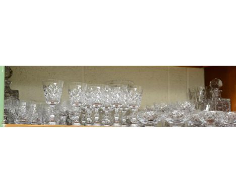 A shelf of Edinburgh and other glass including wines, tumbler and decanters 