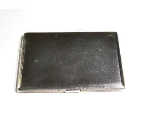 A silver engine turned cigarette case 