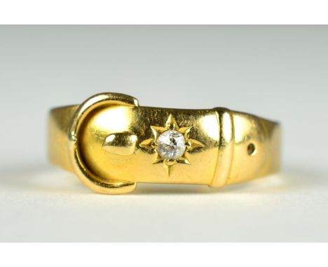 A diamond buckle ring, an old cut diamond star set to a buckle motif shank, estimated diamond weight 0.05 carat approximately