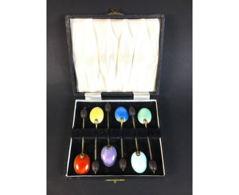 A cased set of six enamel coffee spoons, with coffee bean finials, each 9.3cm long, William Suckling Ltd. Birmingham 1956. 