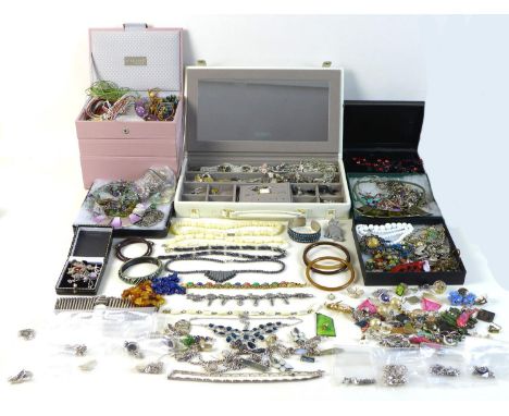 A large collection of costume jewellery including silver earrings, pendants, necklaces, chains, and brooches, as well as some