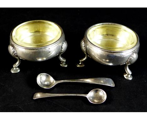 A pair of early George III silver cauldron salts, with parcel gilt interiors, both with engraved monogram possibly 'RA' and c
