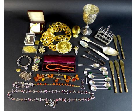 A collection of costume jewellery, silver and silver plated items, including a Ken Lane exaggerated chain link belt with meda