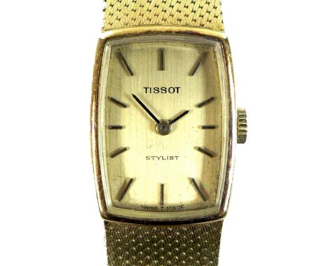 A Tissot Stylist 18ct gold cased lady's wristwatch, circa 1970s, the cushioned rectangular dial with gold /black batons, blac