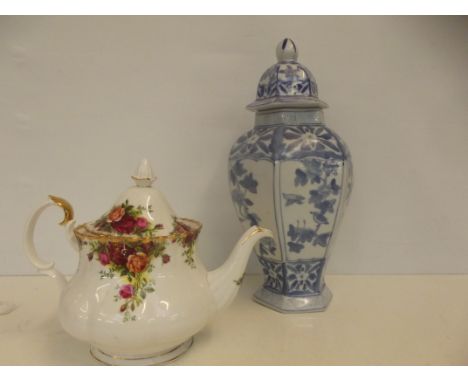 Royal Albert Country Rose teapot together with a blue and white lidded jar, height of jar 36cm 