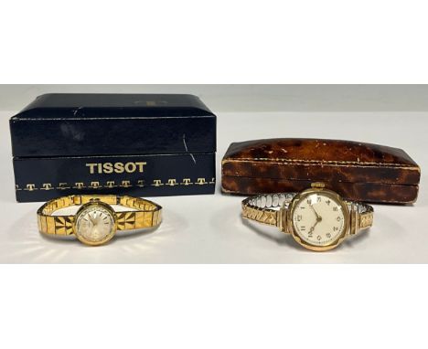 A 9ct gold cased 1930s wristwatch, silver dial,, Arabic numerals, manual stem wind Swiss movement, case Cheater 1933, later e