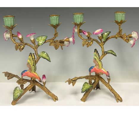A pair of gilt bronze two light candelabra, decorated with humming birds and flowers, 25.5cm high