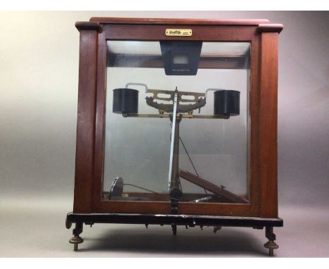 SET OF SCIENTIFIC COUNTER SCALES BY OERTLING. LONDON, ENGLAND with glazed tops and sides, cased in mahogany with sliding fron