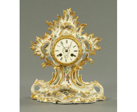 A Continental porcelain Rococo style mantle clock, probably German, with French Paul Mancel, Paris, two-train striking moveme