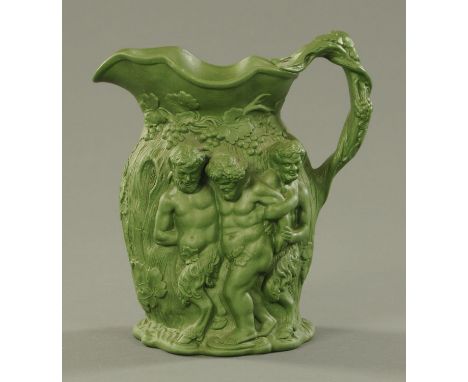 A Minton jade green Drunken Silenus relief moulded jug, 19th century, with applied sprig mark to the underside and impressed 