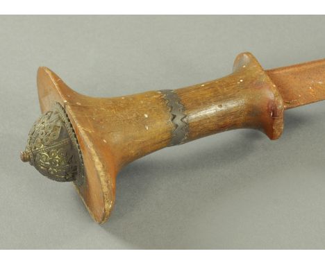 An Ethiopian Gurade, late 19th century, having a single fullered Cavalry blade with rhinoceros horn handle with domed pommel 