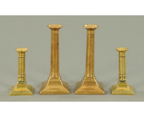 Two pairs of 19th century square based candlesticks.  Tallest 21 cm.    CONDITION REPORT:  The small pair of candlesticks app