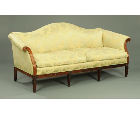 An Edwardian mahogany Chippendale style settee, with arched back, rollover arms, loose cushions, exposed showframe and raised