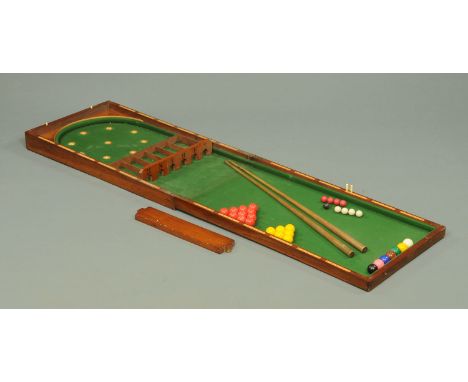 A Victorian table top bar billiards game, with cues and balls.  Width 50 cm, length closed 91 cm.