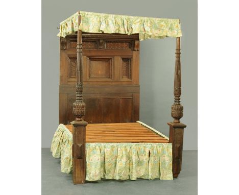 An oak four poster bed, made from sections of antique panelling.  Height 233 cm, width across mattress supports 152 cm, lengt