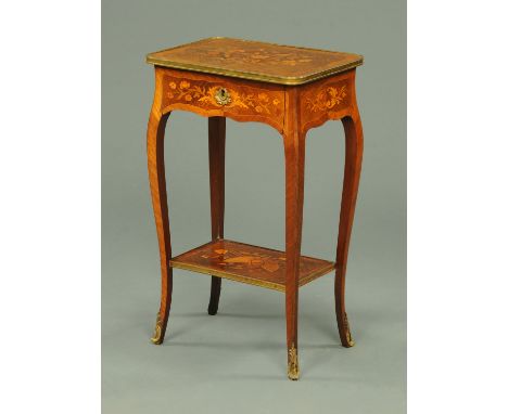 An early 20th century Continental marquetry side table, with brass bound edge, frieze drawer and low shelf, all raised on cab