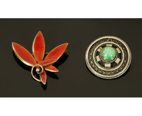  A Norwegian silver and enamel brooch by Albert Scharning, of leaf form with red guilloche enamel.  4.3 cm wide: and a Middle