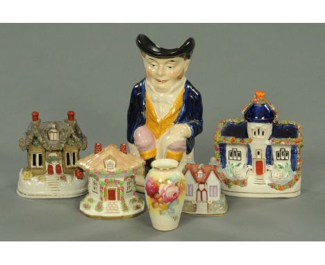 A Royal Worcester vase, painted by M. Hunt, decorated with roses, height 10 cm, a Coalport thatched cottage, three others and