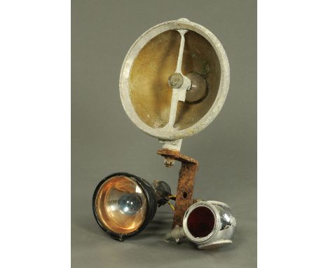 Vintage car parts comprising a Lucas "King of the Road" rear light, circa 1930's, with red glass circular lens and two clear 