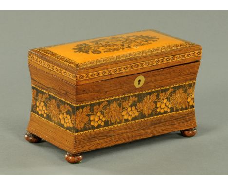 A Tunbridge ware tea caddy, 19th century, typical floral and fruiting vine inlaid decoration upon a waisted body, supported u