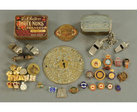 A collection of Great Western Railway and other whistles, enamel badges and a brass safe lock plate.