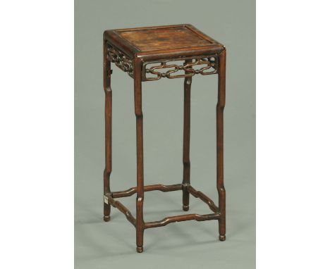 A Chinese carved Hongmu vase table, circa 1900 having a recessed square top and a cloud and bead frieze with shaped legs, 25 