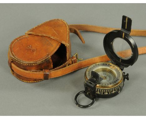 A Second World War Military compass by T.G. Company Ltd., No. 49599, 1940 Mark 3, leather case, dated 1935.