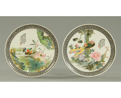 A pair of Chinese porcelain presentation plates, Republic period, one decorated with two ducks amongst lotus leaves and flowe