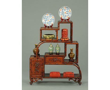 A set of Chinese Hongmu display shelves, mid 20th century, each platform bordered by simulated bamboo with a single drawer an