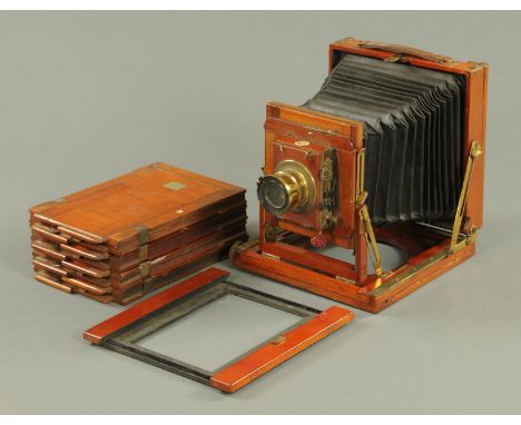 A Thornton-Pickard "College" mahogany field camera, early 20th Century, with rectoplanat lens and ivory inset labels, to take