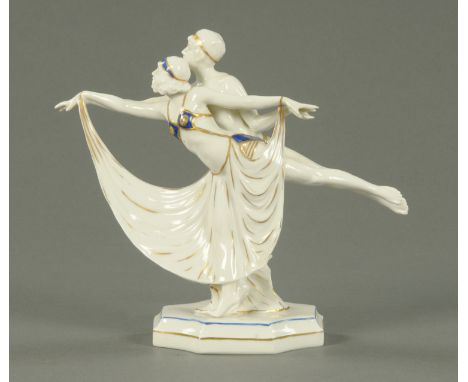 A Sitzendorf porcelain figure group, early 20th century, modelled as a male and female dancer, their legs and arms outstretch