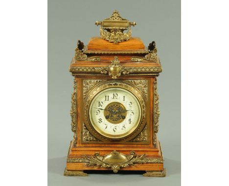 A late 19th century oak and brass mounted bracket clock, with two-train striking movement.  Height 46 cm, width 27 cm, depth 