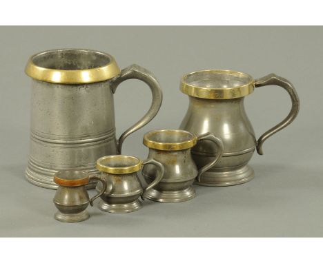 Five Victorian pewter tankards, each with brass rim, four graduated from pint to quarter gill, the largest dated 1829.  Talle