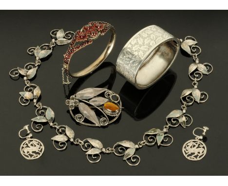 A silver foliate engraved bangle, a Victorian garnet set bracelet, a leaf pattern necklace stamped "silver", a tigers eye mou