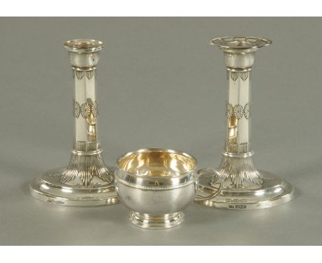 A pair of classical revival silver candlesticks, Harrison Brothers and Howson, Sheffield 1905, 16 cm and a silver cup Adie Br