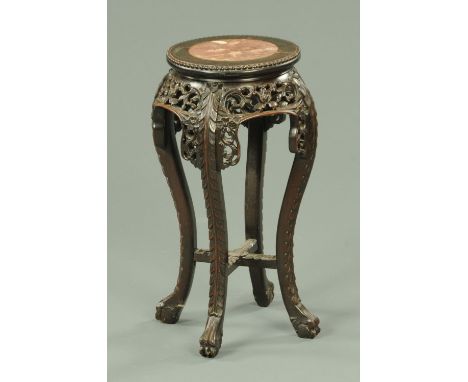 A late 19th century Chinese rouge marble topped jardiniere stand, with pierced frieze and raised on cabriole legs.  Height 57