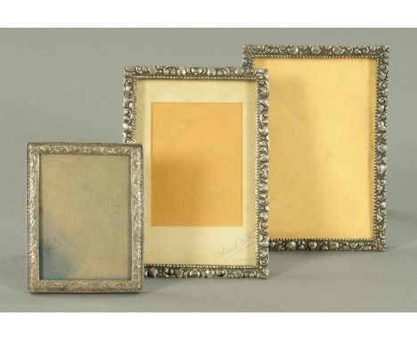 Three Malaysian silver photograph frames.  Tallest 16.5 cm x 11.5 cm, smallest 11.5 cm x 9 cm.     CONDITION REPORT:  The sma