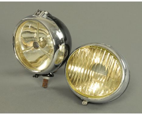 A Lucas Vintage car headlight, early to mid 20th Century, having a clear lens with inset tri bar, chromium hinged mount again